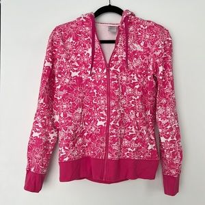 The North Face pink floral zip up hooded sweatshirt.